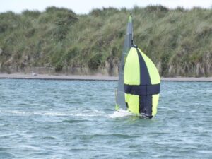 Design 2 Sail the number one radio and free sailing yacht designers - Graham bantock designed vane A 2019 national championship winner Dignity running at speed under spinnaker